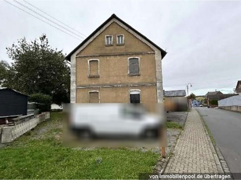 Wohnhaus mit Garage und gewerblich errichtetem Anbau in Mündersbach